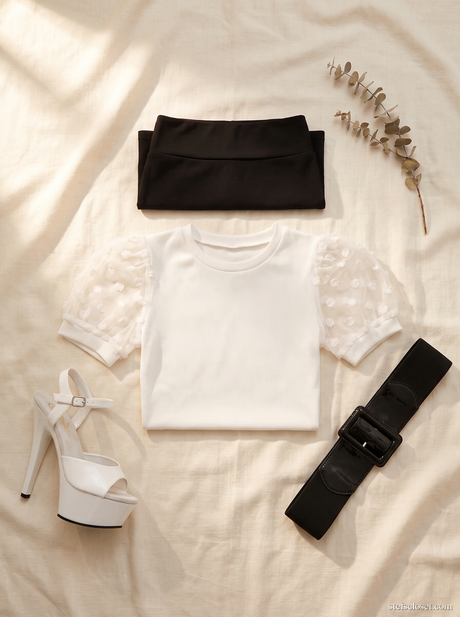 Ivory Column, Black Break — White puff-sleeve top, Black pencil skirt, White platform stilettos, Black cinch belt